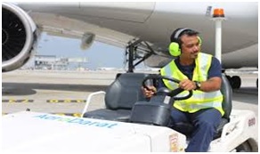 a man in vehicle on runway area