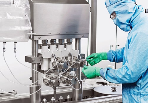 a man covered in blue dress testing equipments